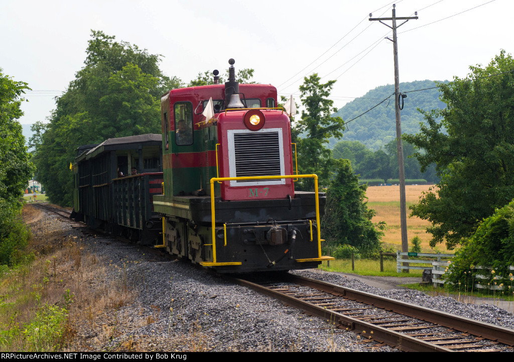 EBT m-7 and the excursion train at Enyart Road grade crossing